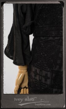 Chomley Frock in Black Embroidered Voile Pinned Back to Side Pocket; Addy Jacket in Signature Black Lightweight Linen Knit; Fairholme Frock in Black and White Picture Book Stripe in High Water Length. By Ivey Abitz.