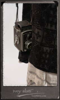 Chomley Frock in Black Embroidered Voile Pinned Back to Side Pocket; Addy Jacket in Signature Black Lightweight Linen Knit; Fairholme Frock in Black and White Picture Book Stripe in High Water Length. By Ivey Abitz.