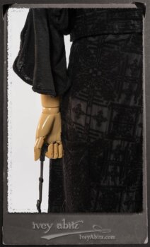 Chomley Frock in Black Embroidered Voile Pinned Back to Side Pocket; Addy Jacket in Signature Black Lightweight Linen Knit; Fairholme Frock in Black and White Picture Book Stripe in High Water Length. By Ivey Abitz.