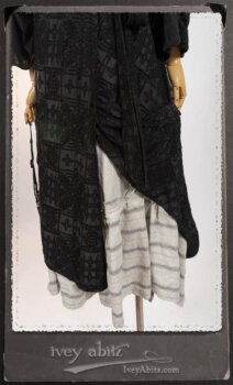 Chomley Frock in Black Embroidered Voile Pinned Back to Side Pocket; Addy Jacket in Signature Black Lightweight Linen Knit; Fairholme Frock in Black and White Picture Book Stripe in High Water Length. By Ivey Abitz.