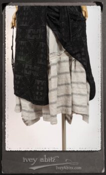 Chomley Frock in Black Embroidered Voile Pinned Back to Side Pocket; Addy Jacket in Signature Black Lightweight Linen Knit; Fairholme Frock in Black and White Picture Book Stripe in High Water Length. By Ivey Abitz.