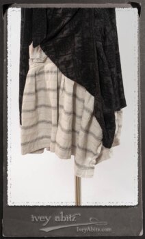 Chomley Frock in Black Embroidered Voile Pinned Back to Side Pocket; Addy Jacket in Signature Black Lightweight Linen Knit; Fairholme Frock in Black and White Picture Book Stripe in High Water Length. By Ivey Abitz.