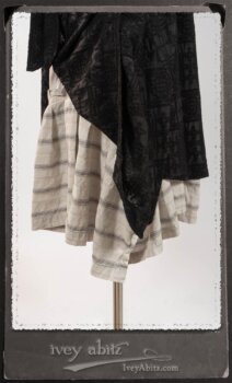 Chomley Frock in Black Embroidered Voile Pinned Back to Side Pocket; Addy Jacket in Signature Black Lightweight Linen Knit; Fairholme Frock in Black and White Picture Book Stripe in High Water Length. By Ivey Abitz.