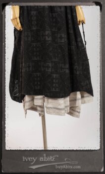 Chomley Frock in Black Embroidered Voile Pinned Back to Side Pocket; Addy Jacket in Signature Black Lightweight Linen Knit; Fairholme Frock in Black and White Picture Book Stripe in High Water Length. By Ivey Abitz.