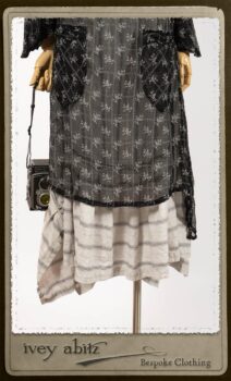 Bramley Dress in White on Black Floral Silk Chiffon; Fairholme Frock in Black and White Picture Book Stripe; Clotaire Sash in White on Black Floral Silk Chiffon. By Ivey Abitz.