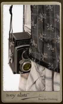 Bramley Dress in White on Black Floral Silk Chiffon; Fairholme Frock in Black and White Picture Book Stripe; Clotaire Sash in White on Black Floral Silk Chiffon. By Ivey Abitz.