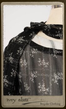 Bramley Dress in White on Black Floral Silk Chiffon; Fairholme Frock in Black and White Picture Book Stripe; Clotaire Sash in White on Black Floral Silk Chiffon. By Ivey Abitz.