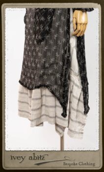 Bramley Dress in White on Black Floral Silk Chiffon; Fairholme Frock in Black and White Picture Book Stripe; Clotaire Sash in White on Black Floral Silk Chiffon. By Ivey Abitz.