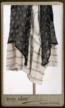 Bramley Dress in White on Black Floral Silk Chiffon; Fairholme Frock in Black and White Picture Book Stripe; Clotaire Sash in White on Black Floral Silk Chiffon. By Ivey Abitz.