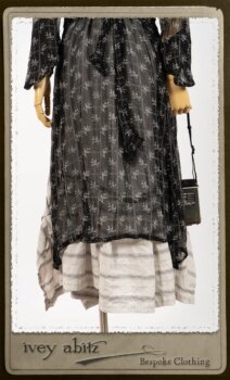 Bramley Dress in White on Black Floral Silk Chiffon; Fairholme Frock in Black and White Picture Book Stripe; Clotaire Sash in White on Black Floral Silk Chiffon. By Ivey Abitz.