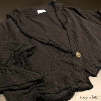 Au Sable Jacket in Black Puckered Check Weave. Adorned with a vintage metal filagree button, Italian, mid 1900's.