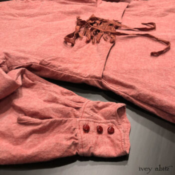 Crest Shirt in Rosy Washed Cotton. Detailed view of back lacing with complimentary silk taffeta ties. Adorned with antique buttons, circa early 1900's.