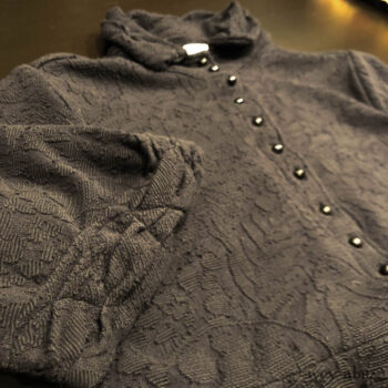 Bertie Jacket in Black Floral Raised Knit. Adorned with antique buttons, circa early 1900's.