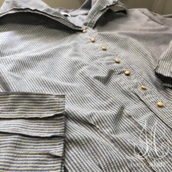 Cordelia Dress in Sun and Sky Washed Seersucker, adorned with antique buttons, circa early 1900&rsquo;s.