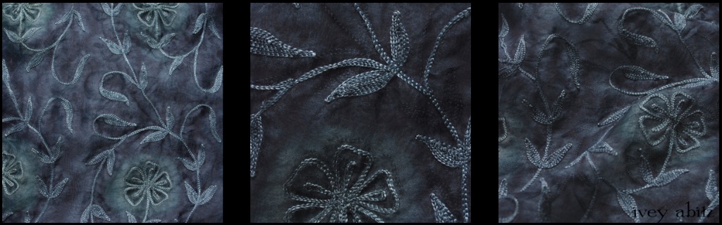 Blue Slate Embroidered Silk Organza - Description: A stunning silk organza is embroidered and then dyed so the background hue varies from a calming deep blue grey to a light blue grey.