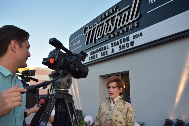 Carolyn Hennesy talking to the press at the Garry Marshall Theatre wearing Ivey Abitz Fall Bespoke.
