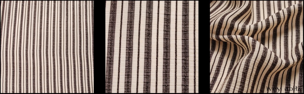 Chimney Crinkled Striped Weave - Description: A mix of Chimney (Black) and Parchment. The crinkled effect is woven right into the weave, and it has a lovely spring to it when pulling on it vertically. Opaque, lightweight, and breathable. Due to its narrow width, it is only available for our shorter shirts and jackets.