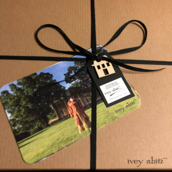 Limited edition postcards are sent as a gift with every bepoke order from the new collection. This box of garments is headed to California.