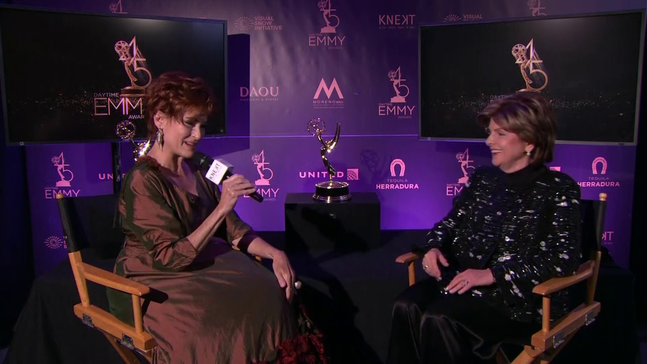 Carolyn Hennesy hosts 45th Daytime Emmys Post Show in her Ivey Abitz gown.