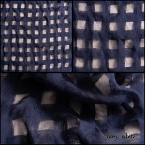 Description: Open weaves are delightful, are they not? They give you an opportunity to have depth in an ensemble without weight. You can tone down the open check design by wearing deep navy under it, or you can play it up by wearing a lighter colour under it. Have fun discovering what pleases and delights you. Your IA garments in this wonderful open check weave will give you charm and versatility in spades!Content: 90 percent linen with a hint of nylon to create the open check design. Woven in Europe. All season weave.Care: Simply hand wash or put through machine delicate cycle in cold water with a plant based detergent. We suggest using a natural fabric softener to maintain the softness we have washed into it. Tumble dry on extra-low heat with our artisan wool dryer balls to keep the relaxed effect that is featured in the Look Book.