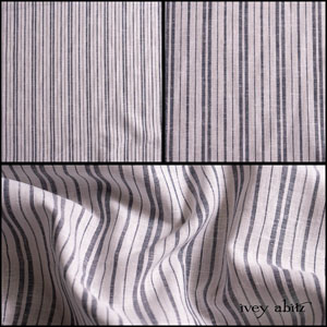 Description: Muted navy and soft whites mixed together have a bold presence without completely taking over the body. That is why we are so smitten with this stripe weave. The two hues are cross woven together to create texture and depth. We have put it through an additional washing process to enhance the softness. It is ideal for layering frocks, shirts, lightweight trousers, sashes, and a selection of our duster coats. Opaque and breathable, it is a good choice for layering in cooler seasons or on its own in warmer temperatures for the hottest summer days. It is thicker than a handkerchief linen and less voluminous than our wondrous washed linens. Content: Linen with a hint of cotton, woven in Europe. All season weave. Care: Simply hand wash or put through machine delicate cycle in cold water with a plant based detergent. We suggest using a natural fabric softener to maintain the softness we have washed into it. Tumble dry on extra-low heat with our artisan wool dryer balls to keep the relaxed effect that is featured in the Look Book. If you are the least bit concerned about any fabric weight or hue, order the fabric swatch portfolio so you can have them in hand whilst you decide. They will answer all of your questions!