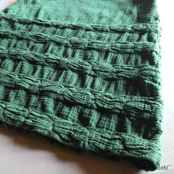 Detailed view of a Bertie Frock. Signature detail in an Ivey Abitz design.