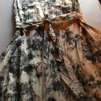 Back view of a frock with a waistband in a sold out floral voile.