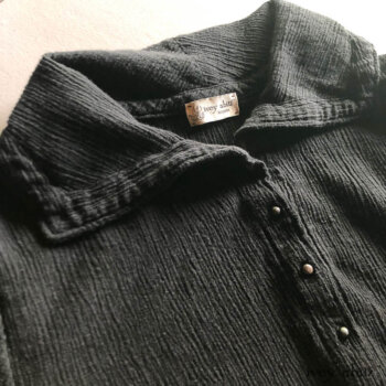 Detailed view of a Porte Cochere Shirt Jacket. Adorned with antique buttons from the late 1800s.