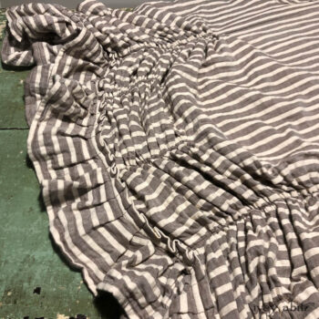 Detailed view of the Clemmie Frock in a sold out weave.