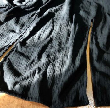 Back bottom hem detail of the Elsie Duster Coat.