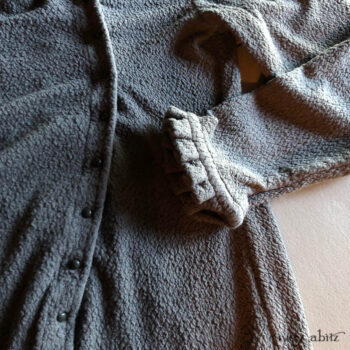 Montmorency Cardigan in a soft, puckered knit. Adorned with antique buttons from the early 1900s.