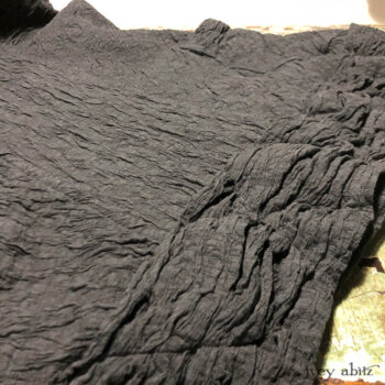 Close-up of a Mewland Jacket in a stunning crinkled weave.